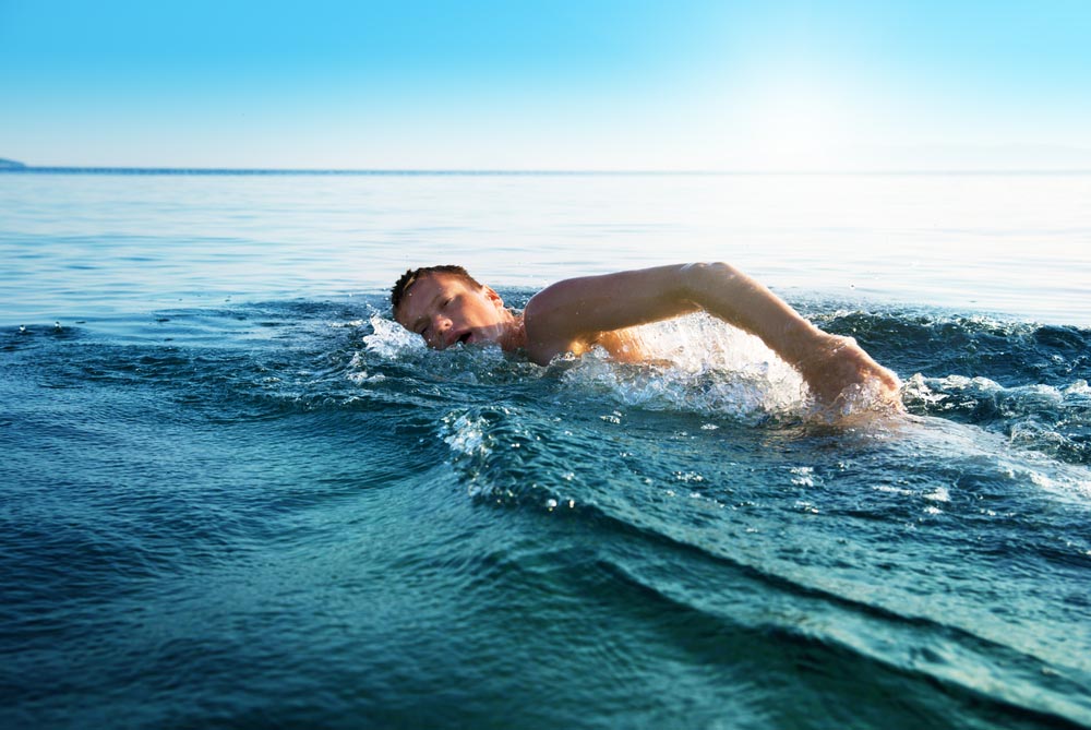 A man swimming in open water