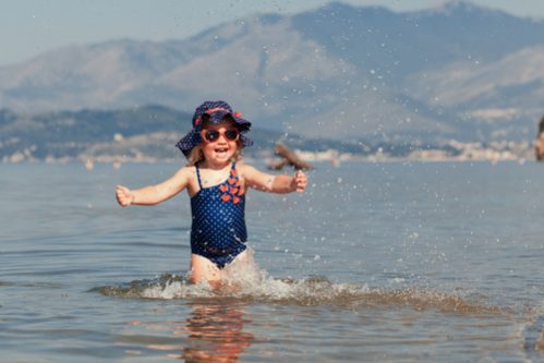 A little girl splashing in the sea