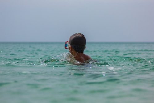 A boy swimming in the sea