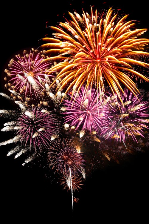 Colourful fireworks against dark sky