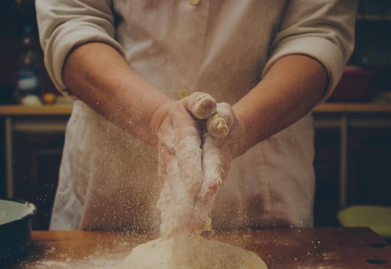A chef making dough