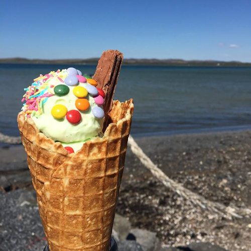 Peatzeria Ice Cream cone with flake and colourful topping