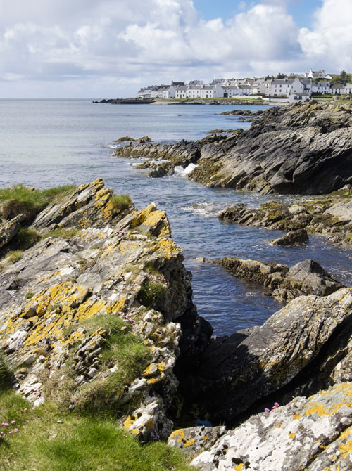 View along rocky coast of Loch Indaal to Port Charlotte, Isle of Islay