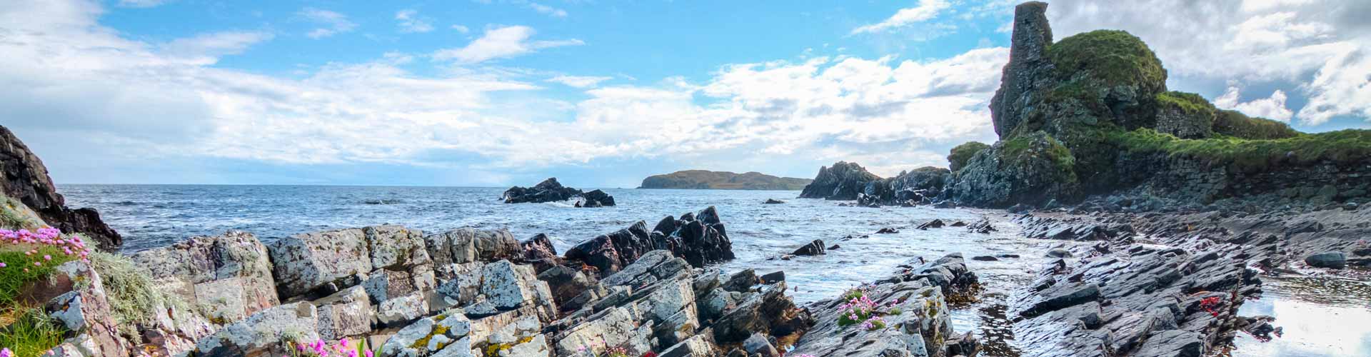 Lagavulin Bay and Dunyvaig Castle on the coastline of Islay