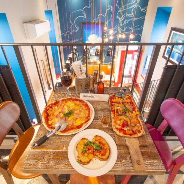 Selection of pizzas on a table at Peatzeria restaurant