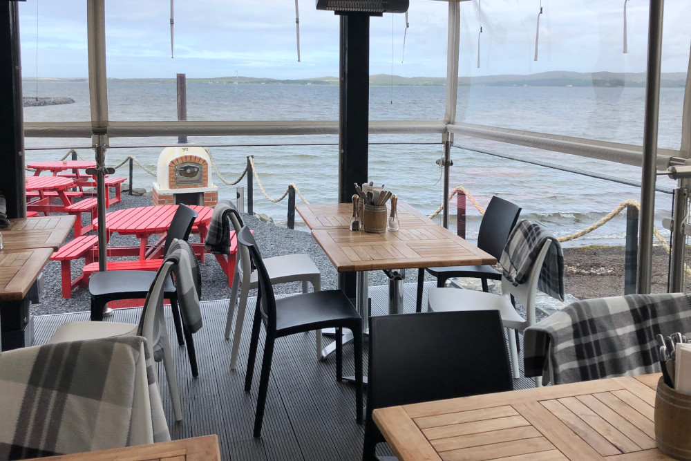 Restaurant seating with views of Lochindaal