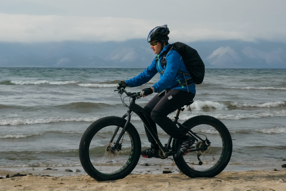 Fat bike also called fatbike or fat-tire bike in summer driving on the beach