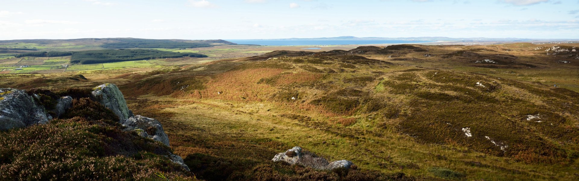 Panoramic aerial view of rocky shores, valleys and hills of isle of Islay