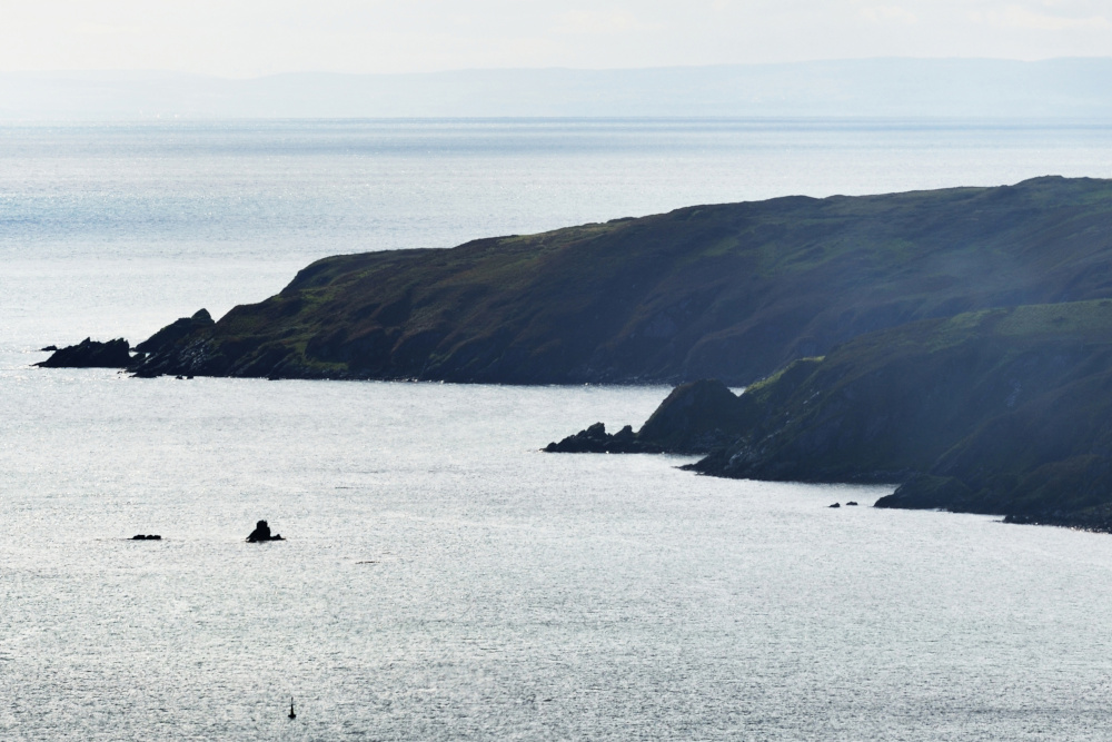 Aerial view of rocky shores, valleys and hills of isle of Islay.