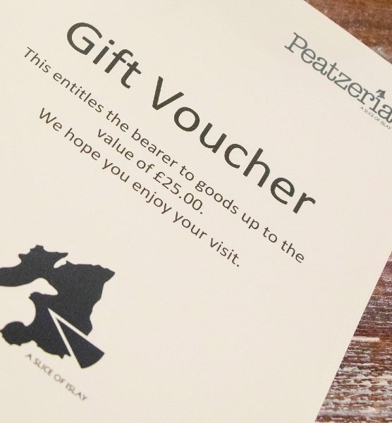 Photo of meal gift voucher on wooden table