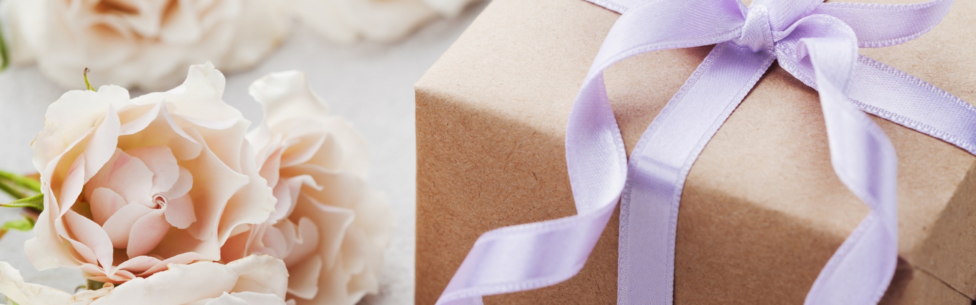 Beautifully wrapped gift with roses