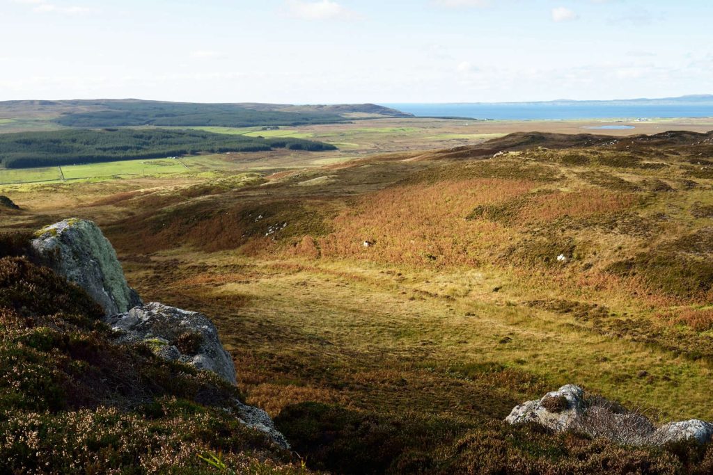 Panoramic aerial view of rocky shores, valleys and hills of isle of Islay, Inner Hebrides.