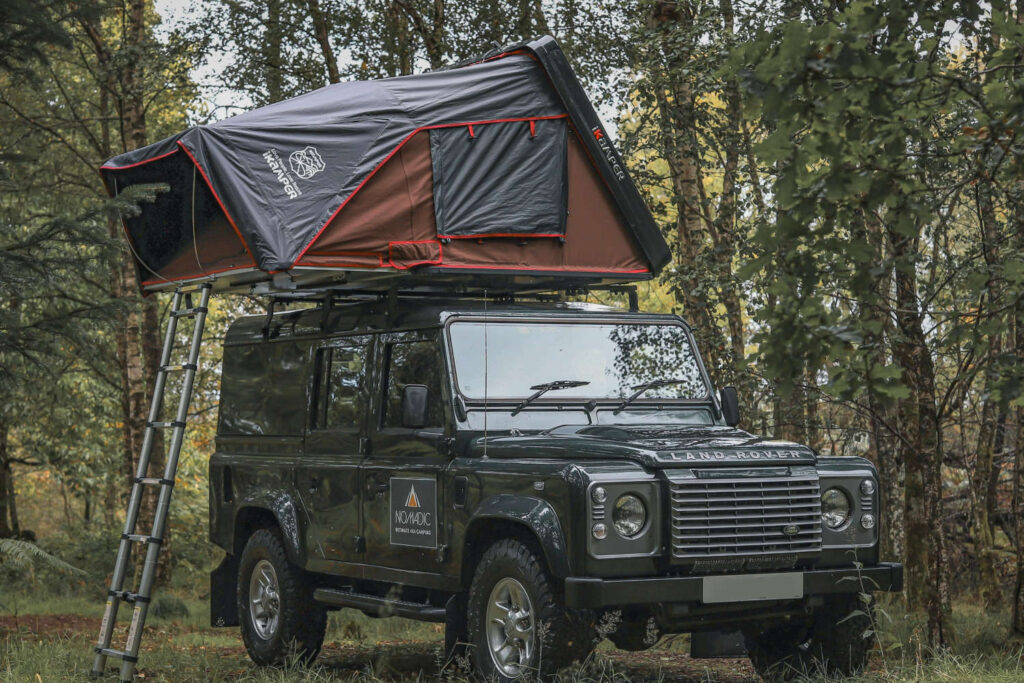 Land Rover 4x4 fitted with roof tent for camping