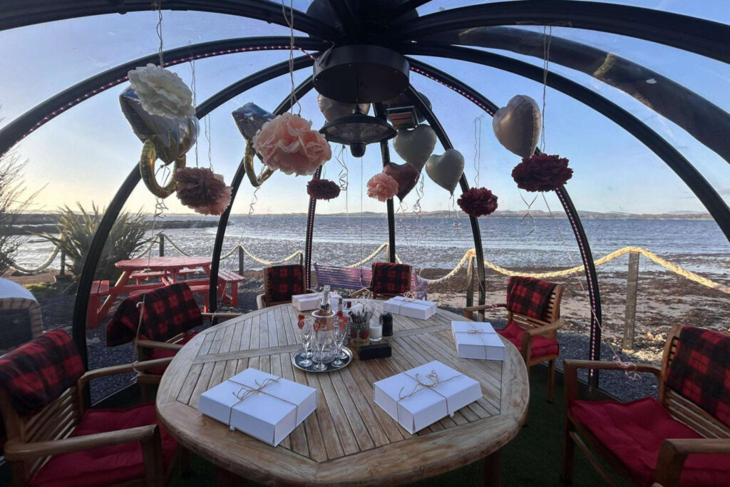 Outdoor seating at Peatzeria with views.